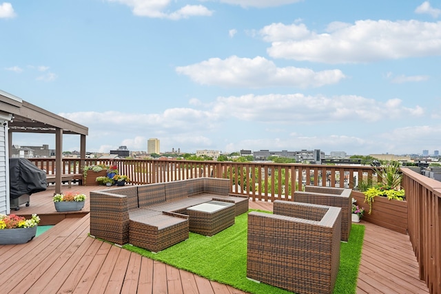 wooden terrace with outdoor lounge area