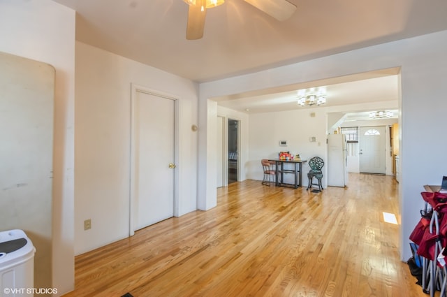 interior space with ceiling fan and light hardwood / wood-style floors