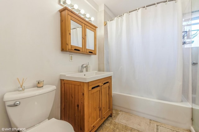 full bath featuring shower / bath combo, toilet, and vanity