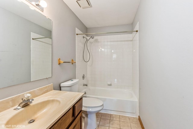 full bathroom with toilet, vanity, tile patterned floors, and tiled shower / bath