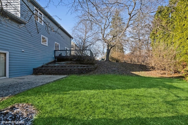 view of yard featuring a wooden deck