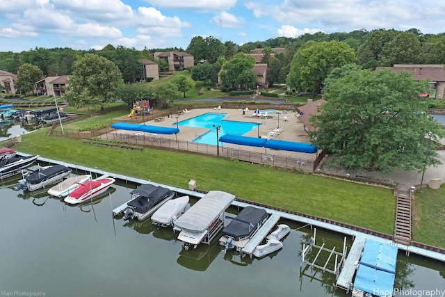 birds eye view of property with a water view