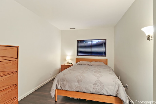 bedroom featuring dark hardwood / wood-style flooring