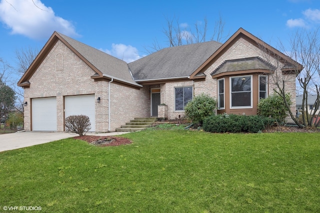 view of front of property with a front yard and a garage