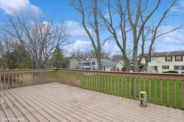 wooden deck with a yard