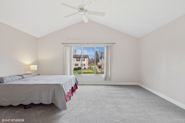 bedroom with ceiling fan, light colored carpet, and vaulted ceiling