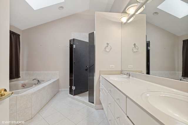 bathroom featuring tile patterned floors, lofted ceiling with skylight, vanity, and independent shower and bath