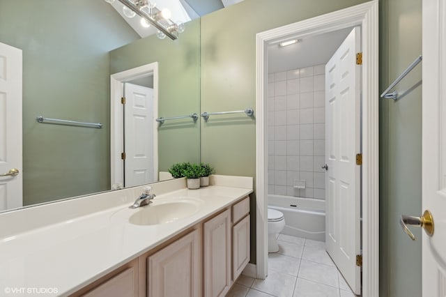 full bathroom with tile patterned flooring, vanity, toilet, and tiled shower / bath