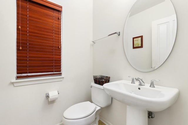 bathroom with toilet and sink