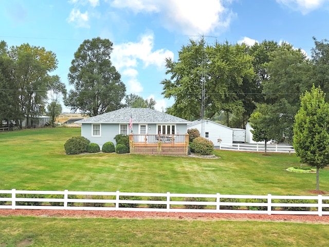 view of front of home with a deck and a front yard