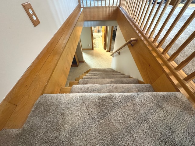 stairs featuring carpet