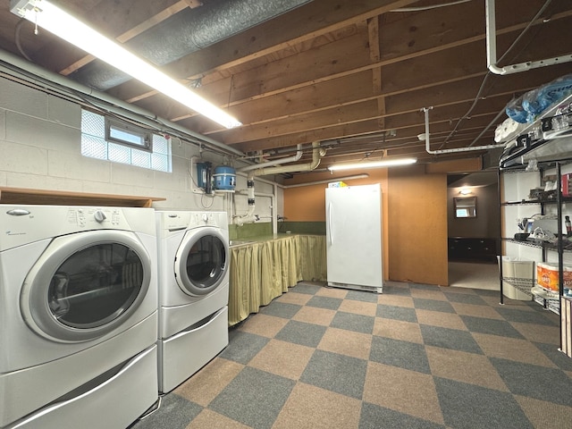 laundry area with separate washer and dryer