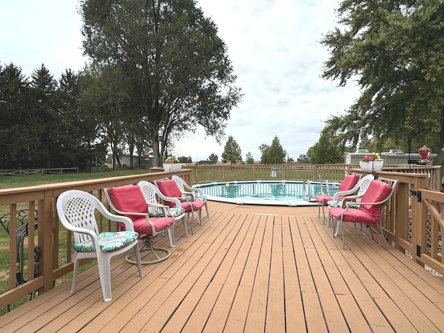 wooden deck featuring a fenced in pool