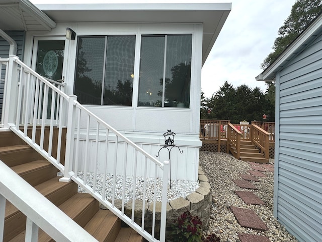 view of property exterior featuring a wooden deck