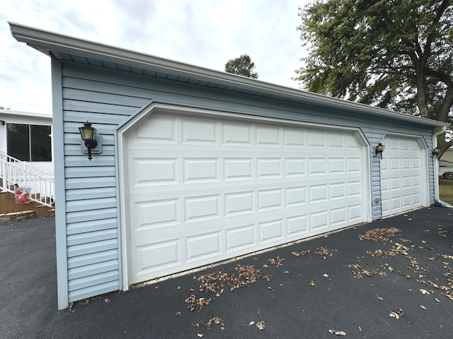 garage featuring wooden walls