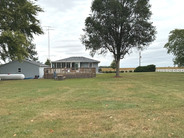 view of yard with a wooden deck