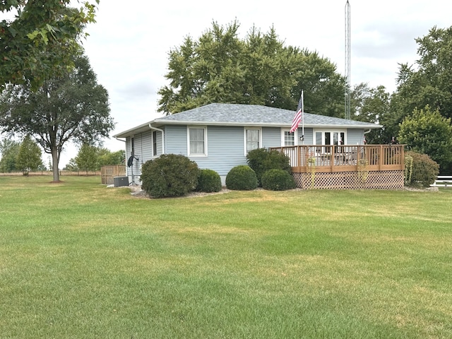 view of property exterior with a lawn, cooling unit, and a deck