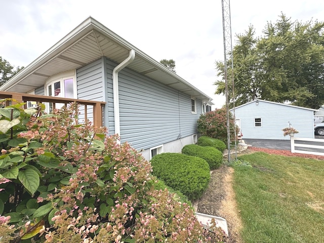 view of home's exterior featuring a yard