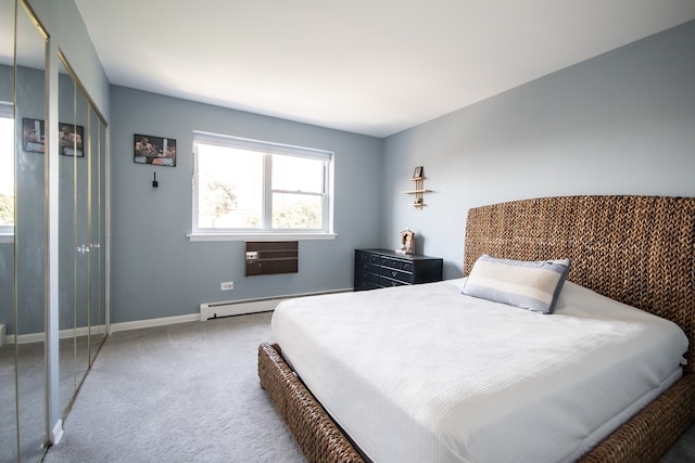 carpeted bedroom featuring a baseboard radiator and an AC wall unit