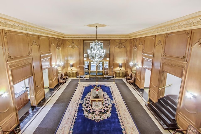 interior space with an inviting chandelier and ornamental molding