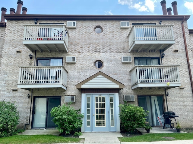 back of house featuring a balcony