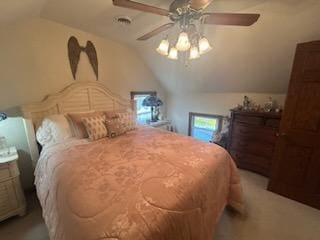 carpeted bedroom featuring vaulted ceiling and ceiling fan