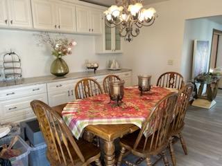 dining space with dark wood-type flooring