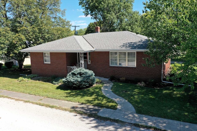 ranch-style home featuring a front yard