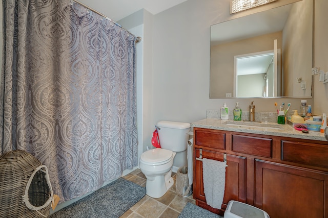 bathroom featuring vanity, toilet, and a shower with shower curtain