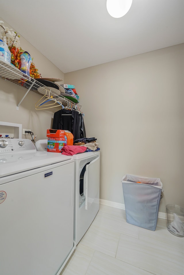 clothes washing area with independent washer and dryer