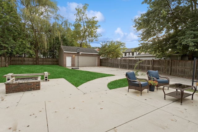 view of patio featuring an outbuilding and a fire pit