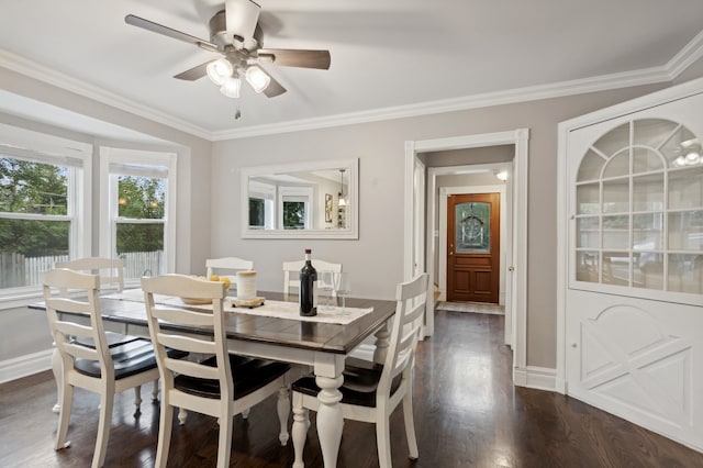 dining area featuring ceiling fan, crown molding, and dark hardwood / wood-style flooring