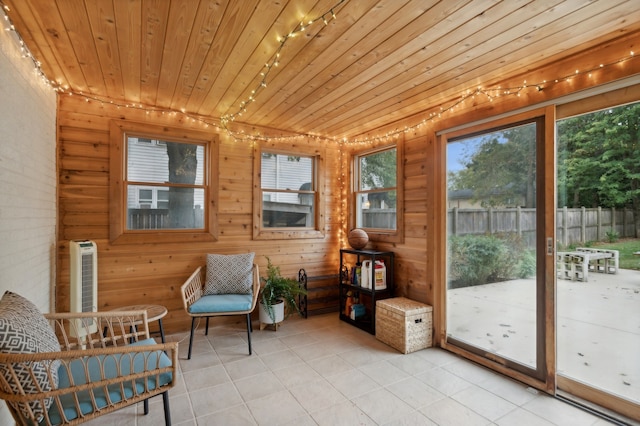 sunroom / solarium featuring wood ceiling and heating unit