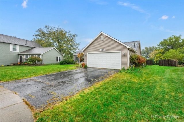 view of front facade featuring a front lawn and a garage