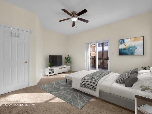 carpeted bedroom featuring access to outside and ceiling fan