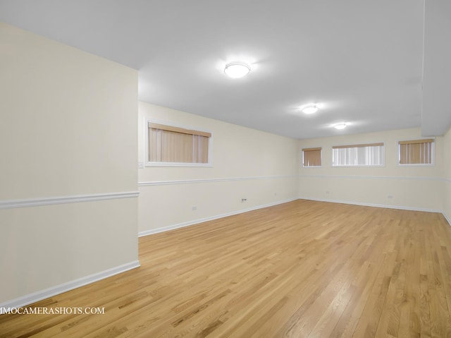 unfurnished room with light wood-type flooring