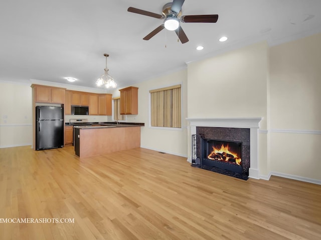 kitchen with light hardwood / wood-style flooring, decorative light fixtures, ceiling fan, crown molding, and black appliances