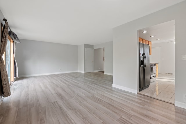 unfurnished living room with light hardwood / wood-style flooring