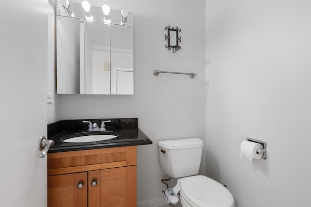 bathroom with toilet and vanity