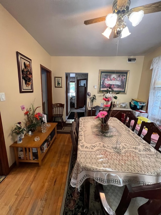 dining room featuring ceiling fan and hardwood / wood-style floors