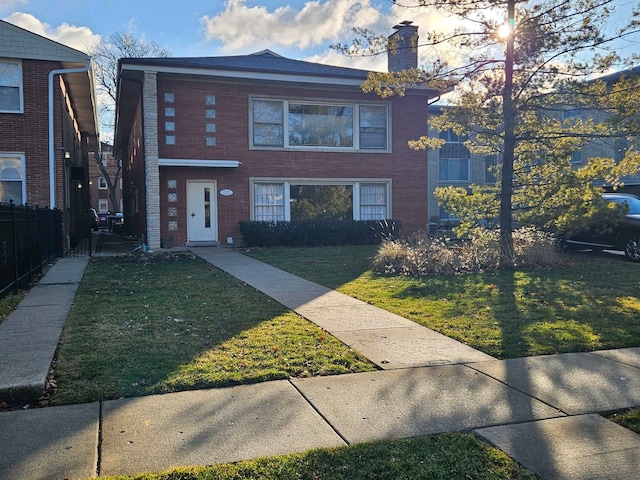 view of front of home with a front yard