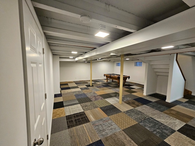 basement featuring dark carpet and pool table