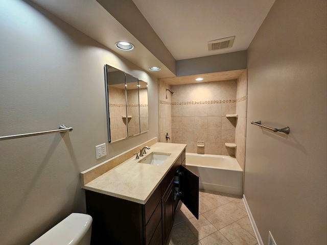 full bathroom with tiled shower / bath combo, vanity, toilet, and tile patterned floors