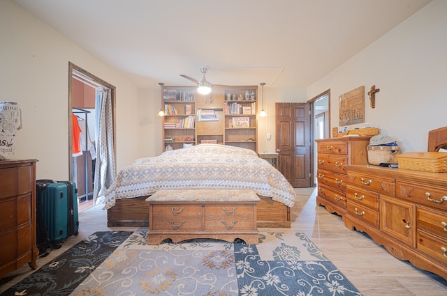 bedroom featuring light hardwood / wood-style flooring and ceiling fan