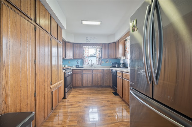 kitchen featuring hardwood / wood-style floors and stainless steel appliances