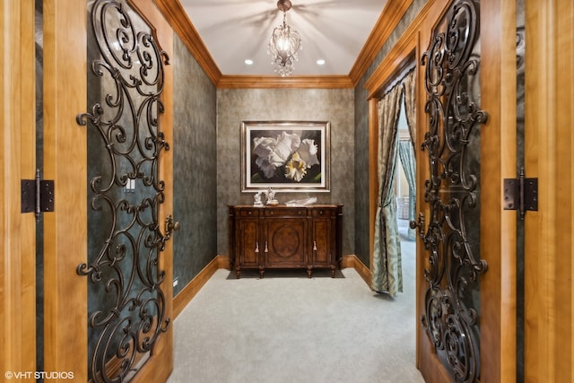 interior space featuring light colored carpet, a notable chandelier, and ornamental molding