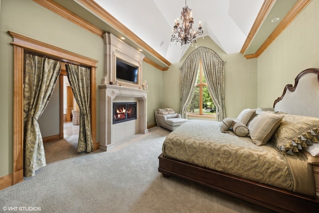 carpeted bedroom featuring a tiled fireplace, a chandelier, crown molding, and high vaulted ceiling