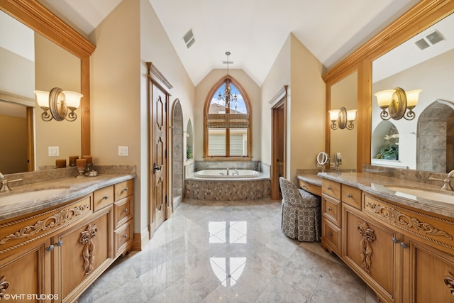 bathroom featuring a notable chandelier, vanity, lofted ceiling, and a relaxing tiled tub