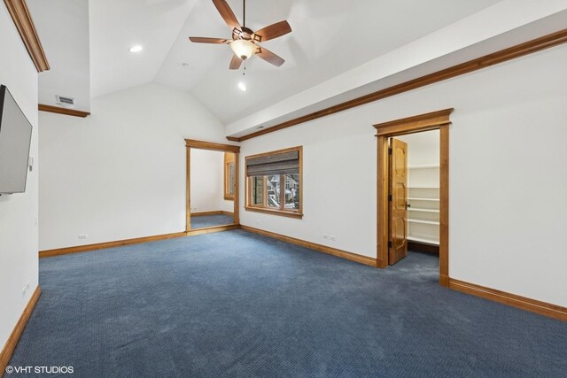 spacious closet featuring vaulted ceiling and light colored carpet