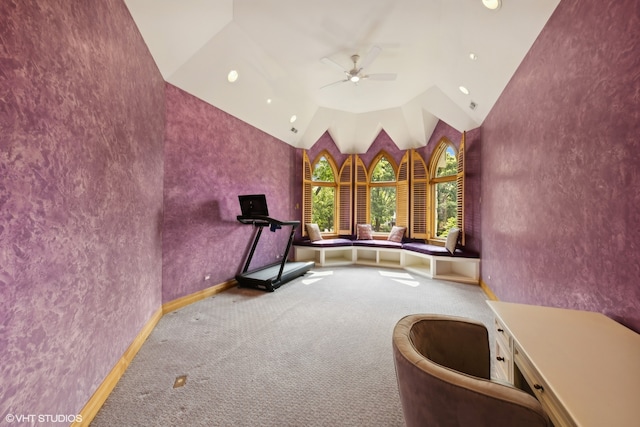 unfurnished room featuring ceiling fan, lofted ceiling, and carpet flooring